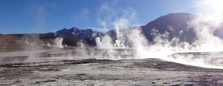 San Pedro de Atacama: El Tatio Geysers & Machuca Lagoon Trip - Entering El Tatio: steam, thermal pools, and a field with real scale