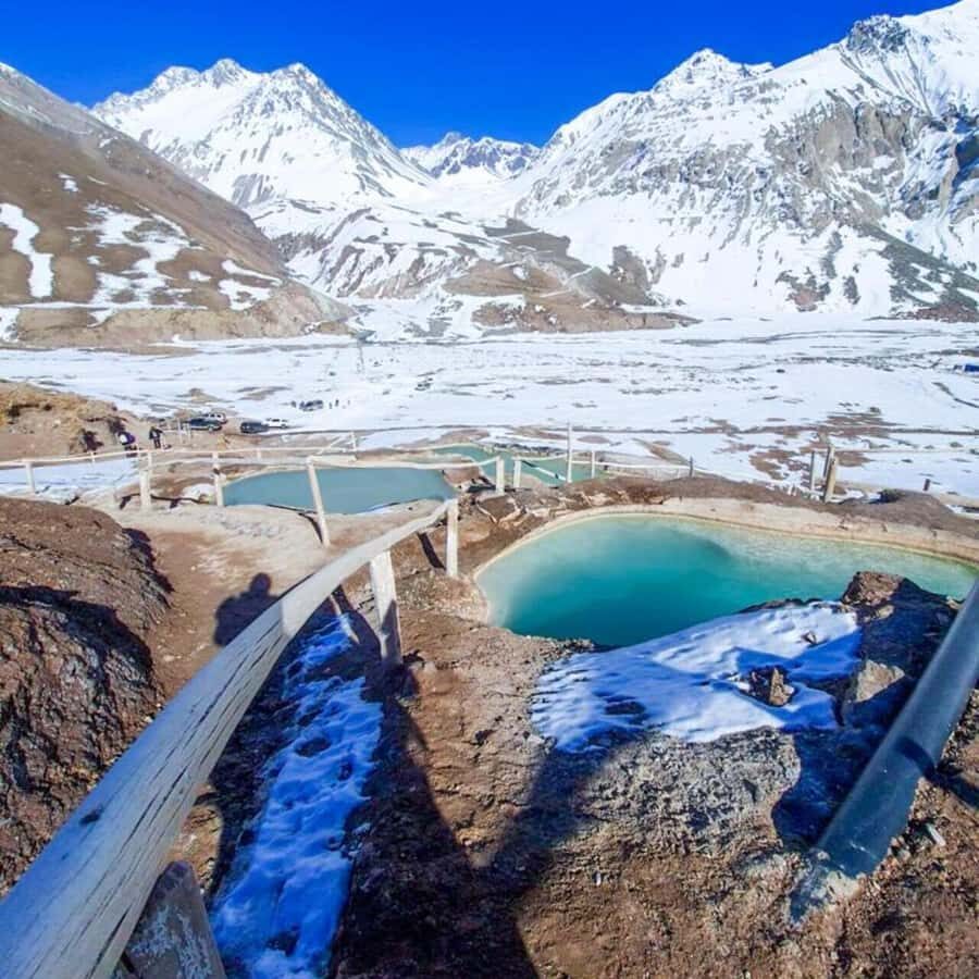 Santiago: Cajon del Maipo Termas Colina Trip - Tinoco Tunnel and its shrines: a seasonal stop with a heavy story