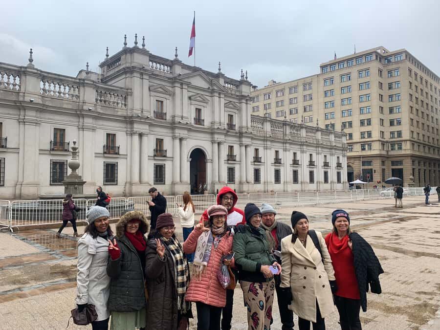 Santiago: Guided Walking Tour through the Historic Center - Plaza de Armas: Statues, Daily Life, and the Old-versus-New View